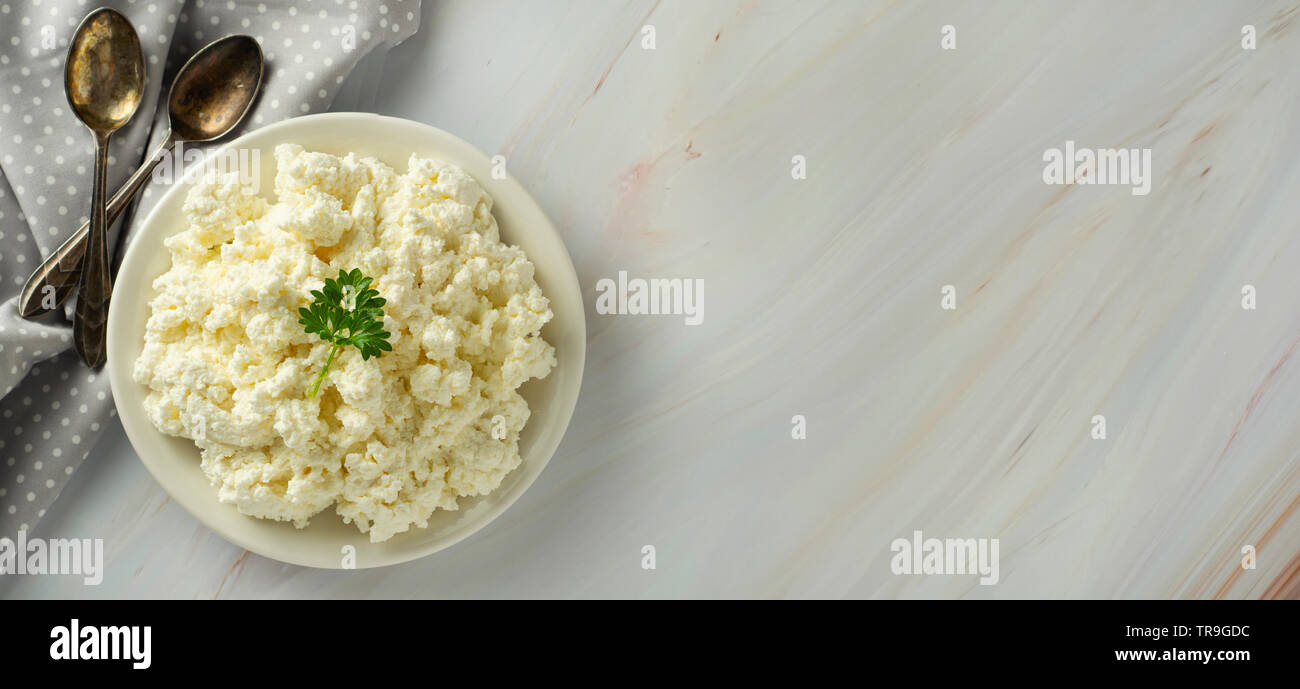 Cottage cheese banner, isoalted on light, marble background. Dairy