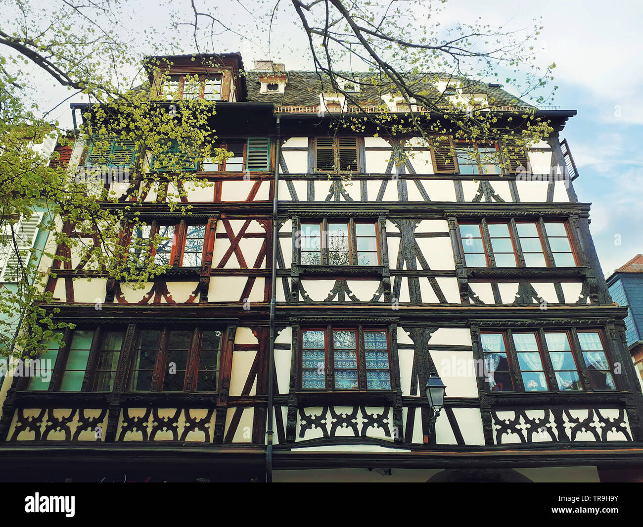 Fachwerk timber framed house in Strasbourg city, France, Alsace. Traditional architecture medieval home facade, historic town. Beautiful black and whi Stock Photo