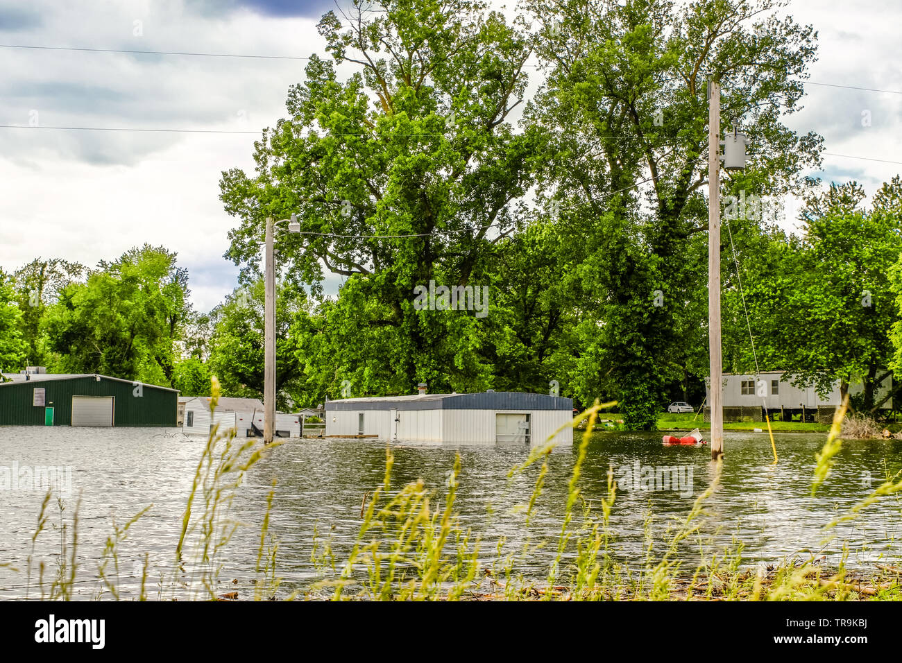 View of mobile houses flooded by Missouri River in spring; Missouri, Midwest Stock Photo