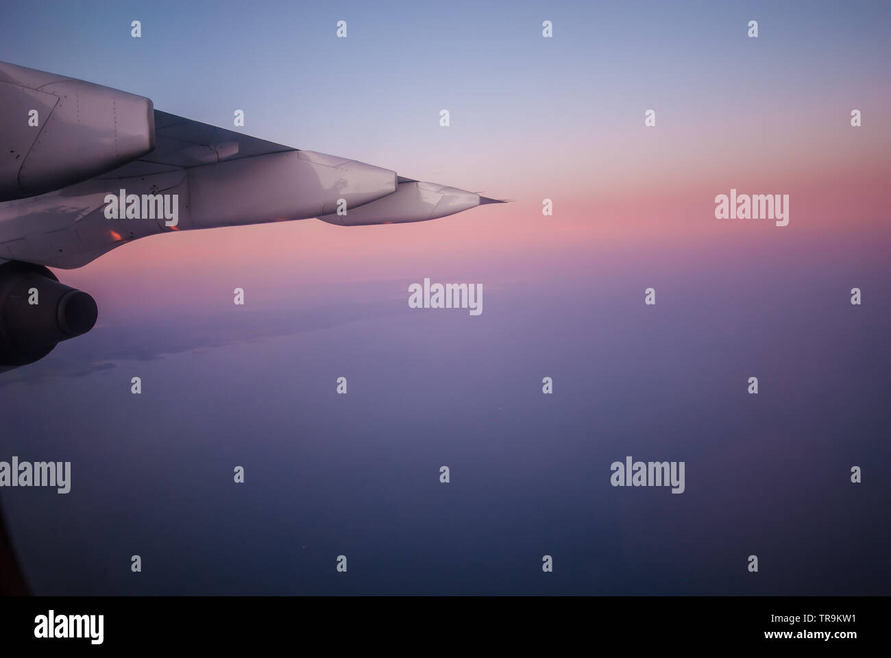 The wing of an airplane and a beautiful sunset Stock Photo - Alamy