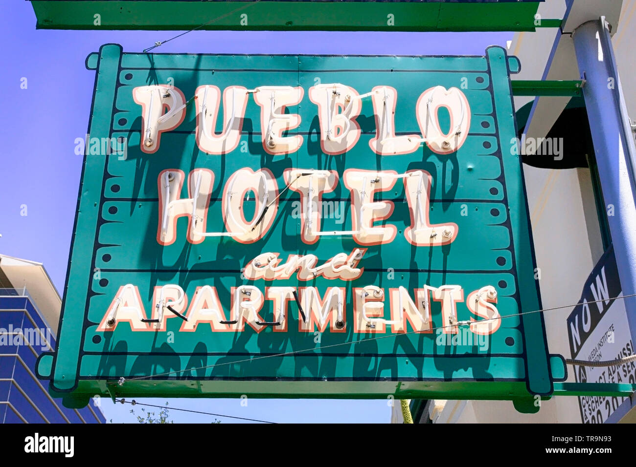 Pueblow Hotel and Apartments overhead neon signs on 6th Street in Tucson AZ Stock Photo