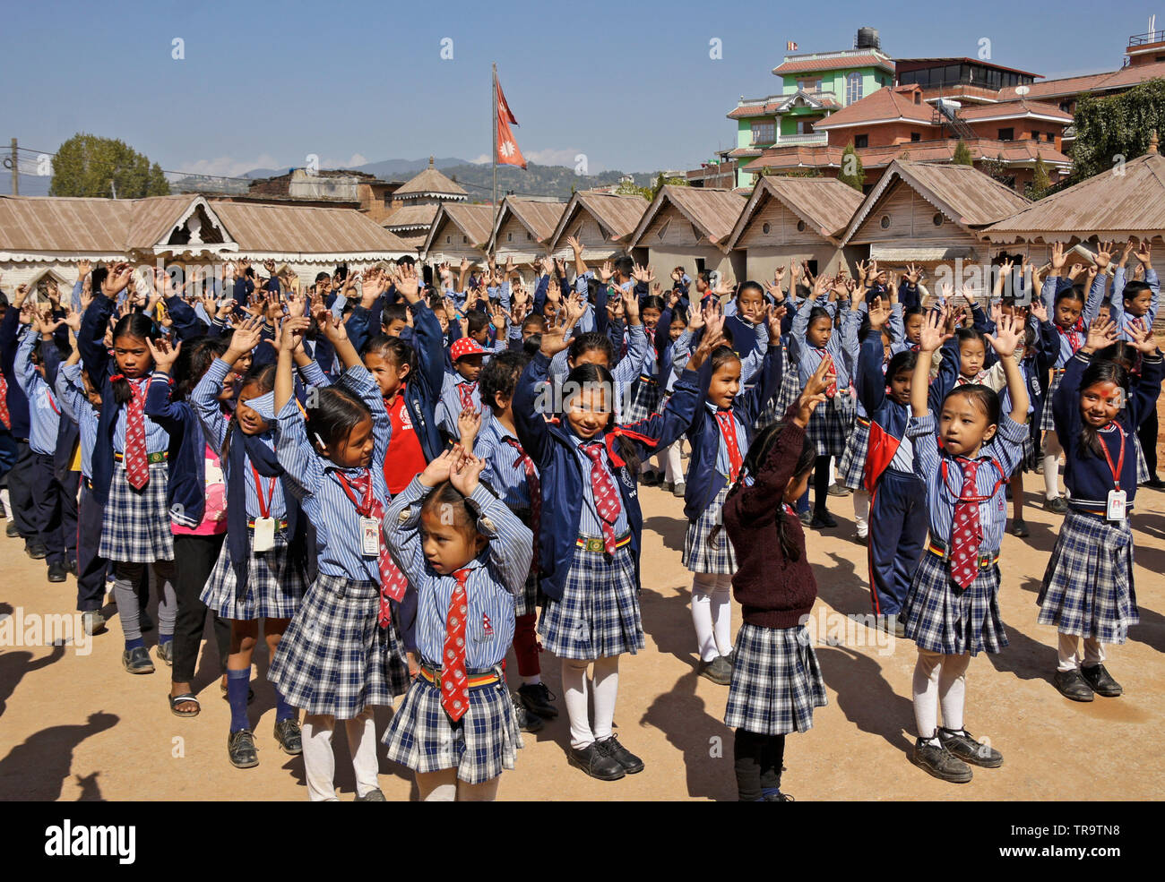 Students in school uniform assembling on grounds of Samata Bamboo School, Bhaktapur, Kathmandu Valley, Nepal Stock Photo
