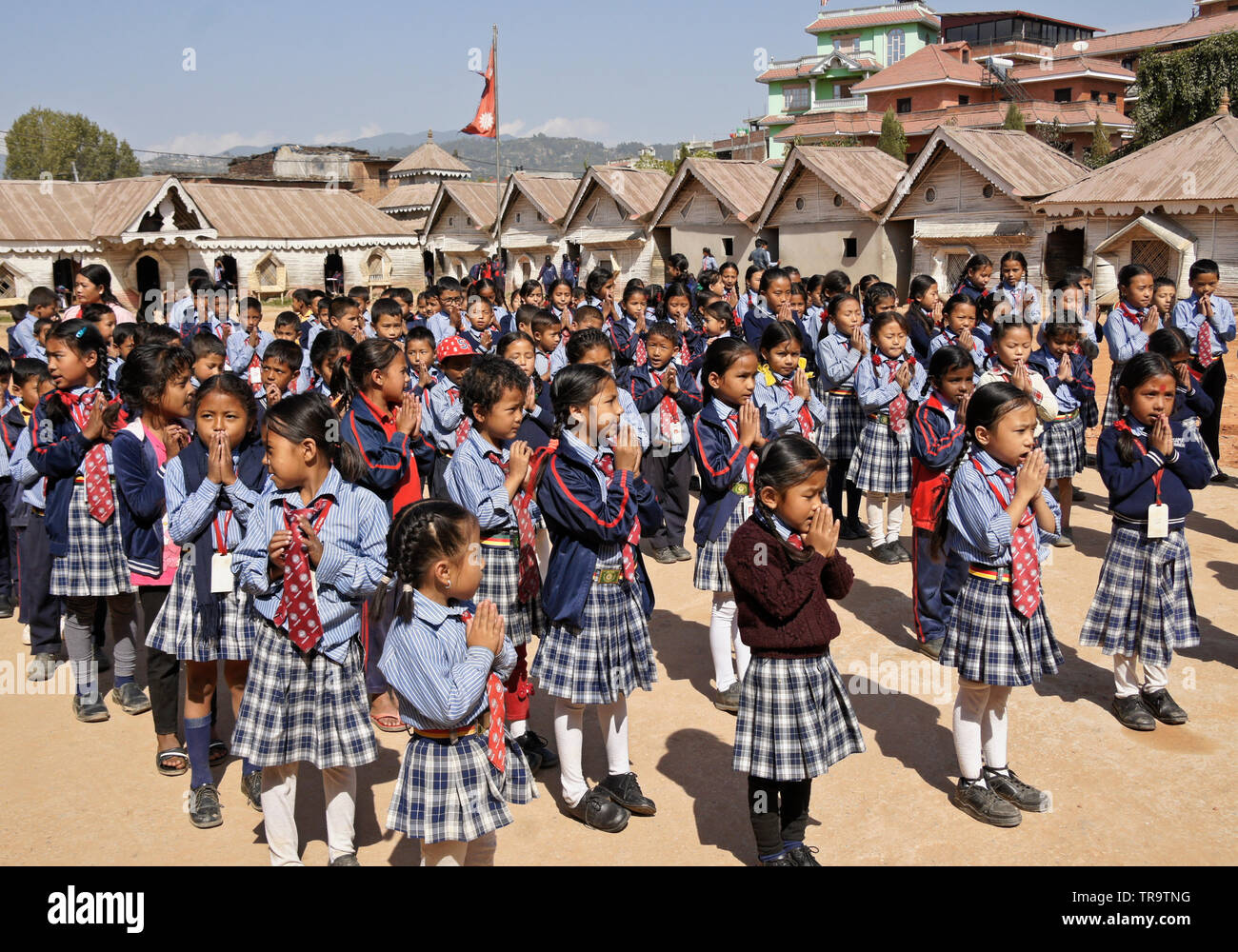 Students in school uniform assembling on grounds of Samata Bamboo School, Bhaktapur, Kathmandu Valley, Nepal Stock Photo