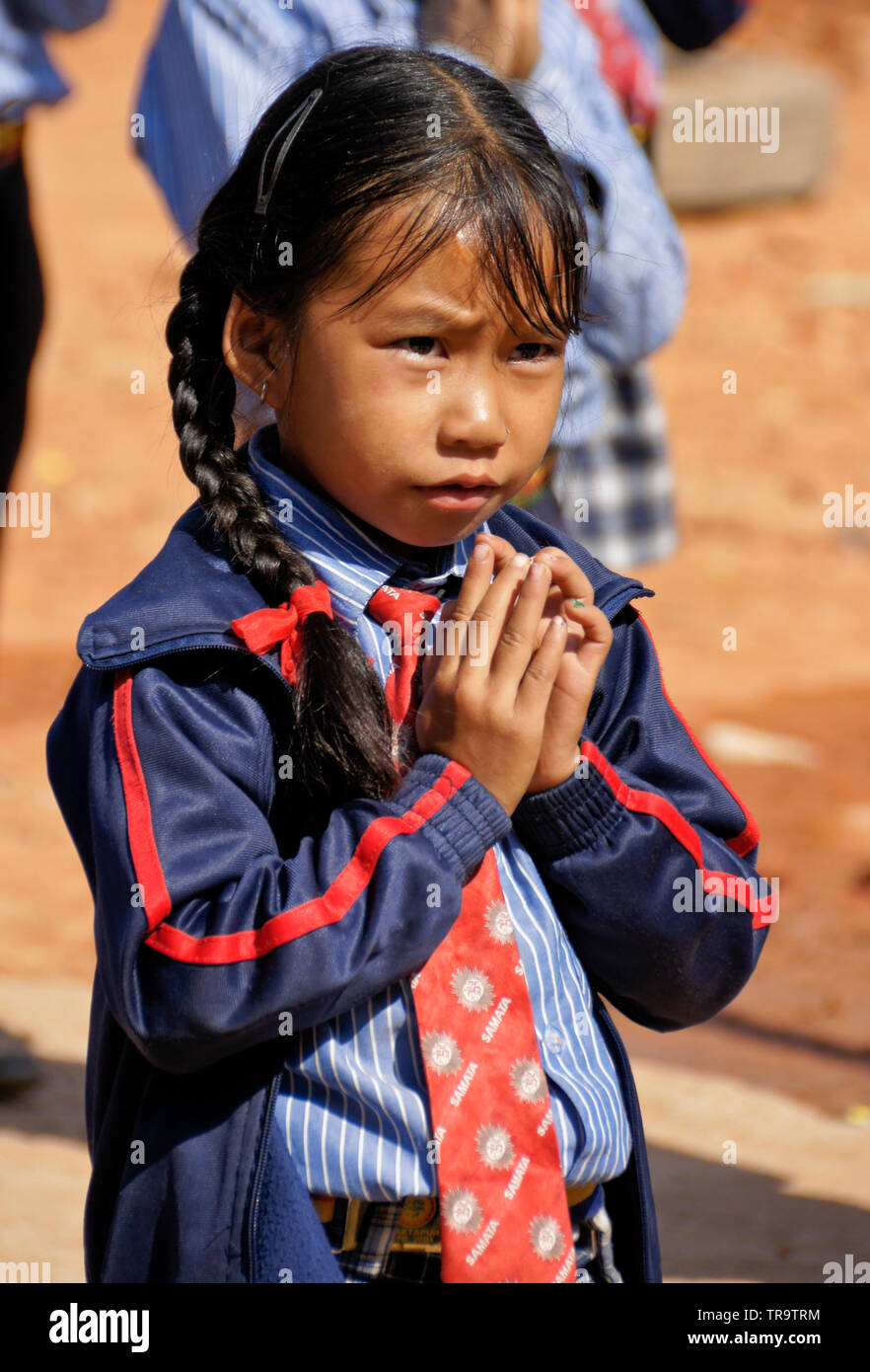 Portrait of young girl in school uniform at Samata Bamboo School, Bhaktapur, Kathmandu Valley, Nepal Stock Photo