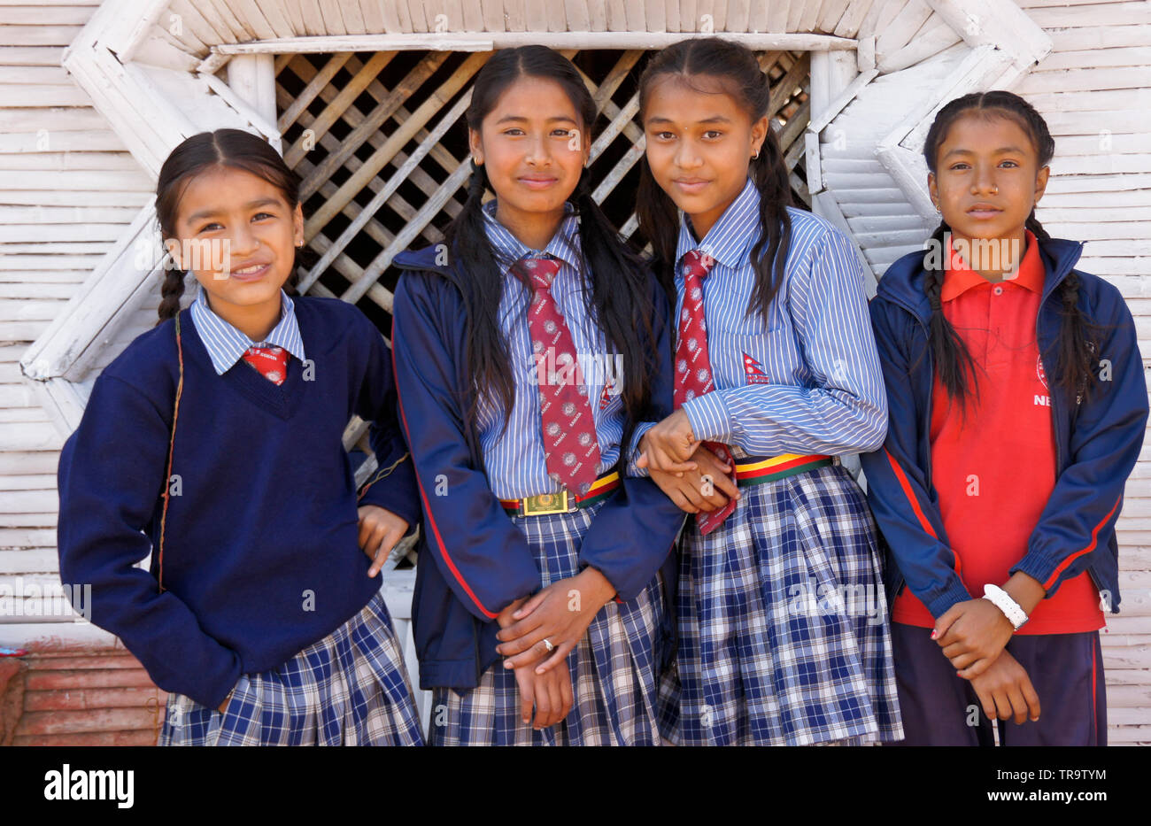Four female students in school uniform at Samata Bamboo School, Bhaktapur, Kathmandu Valley, Nepal Stock Photo