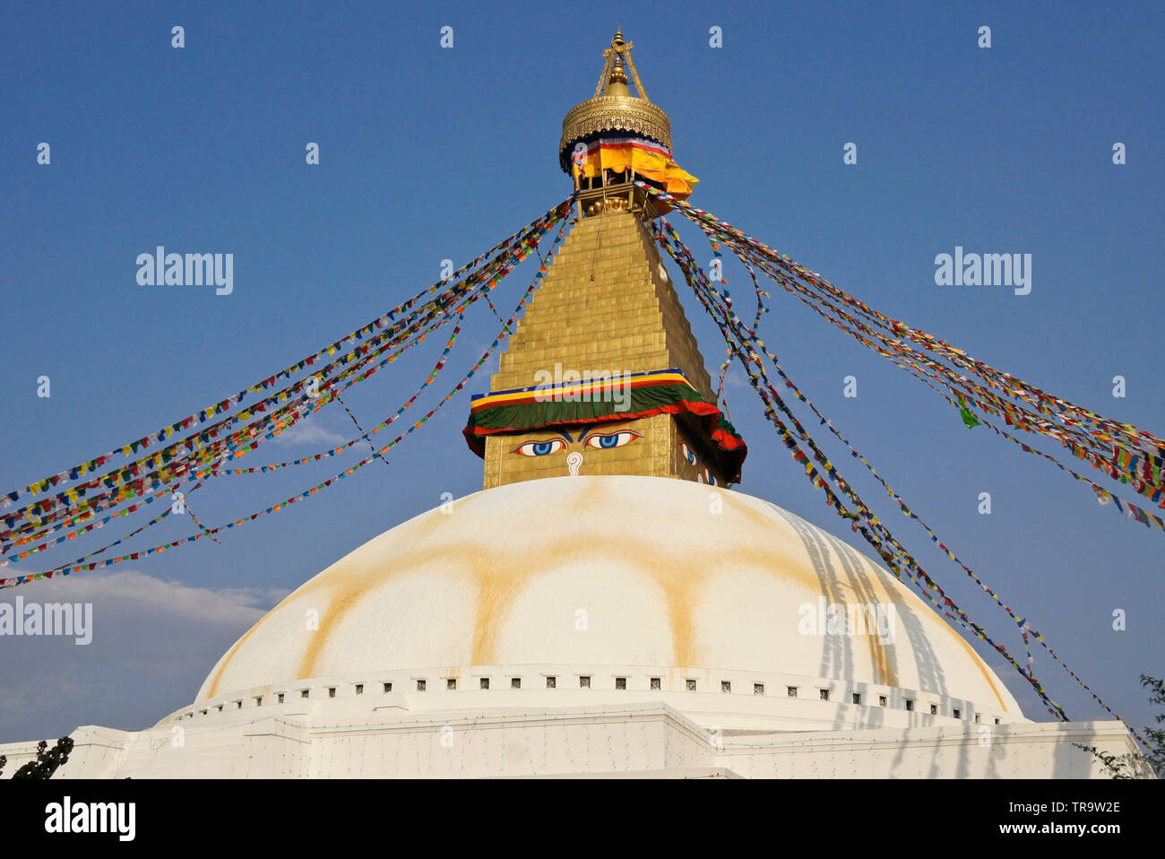 Boudhanath Tibetan Buddhist stupa with colorful prayer flags flying, Kathmandu, Nepal Stock Photo