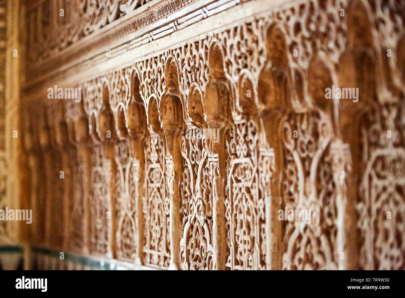 Intricate carvings in wall at Alhambra, in Granada, Spain. Stock Photo