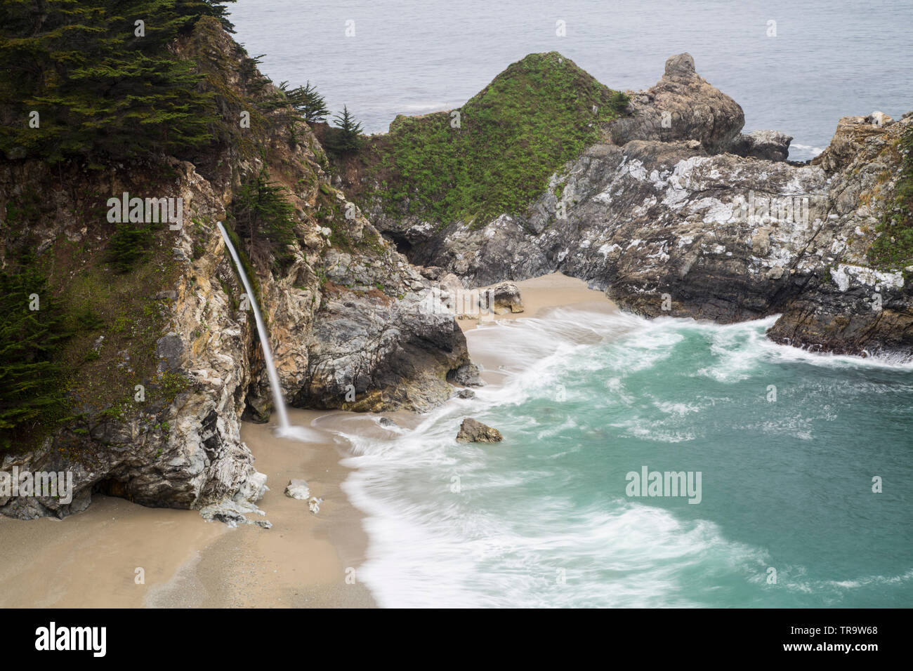 McWay falls in California's Big Sur, water falls into the crashing