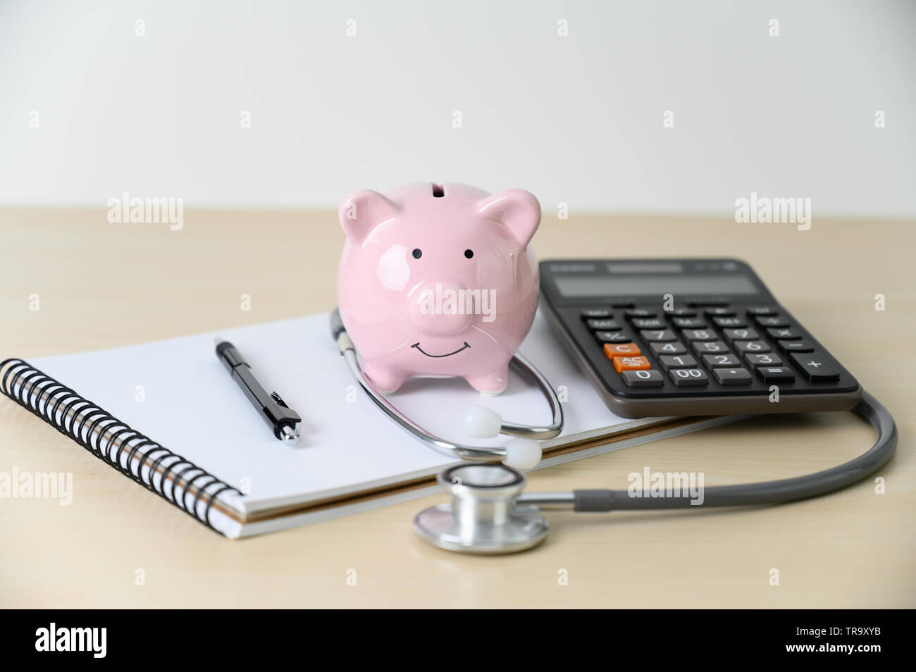 with or stethoscope Piggy ... checkup for bank saving financial