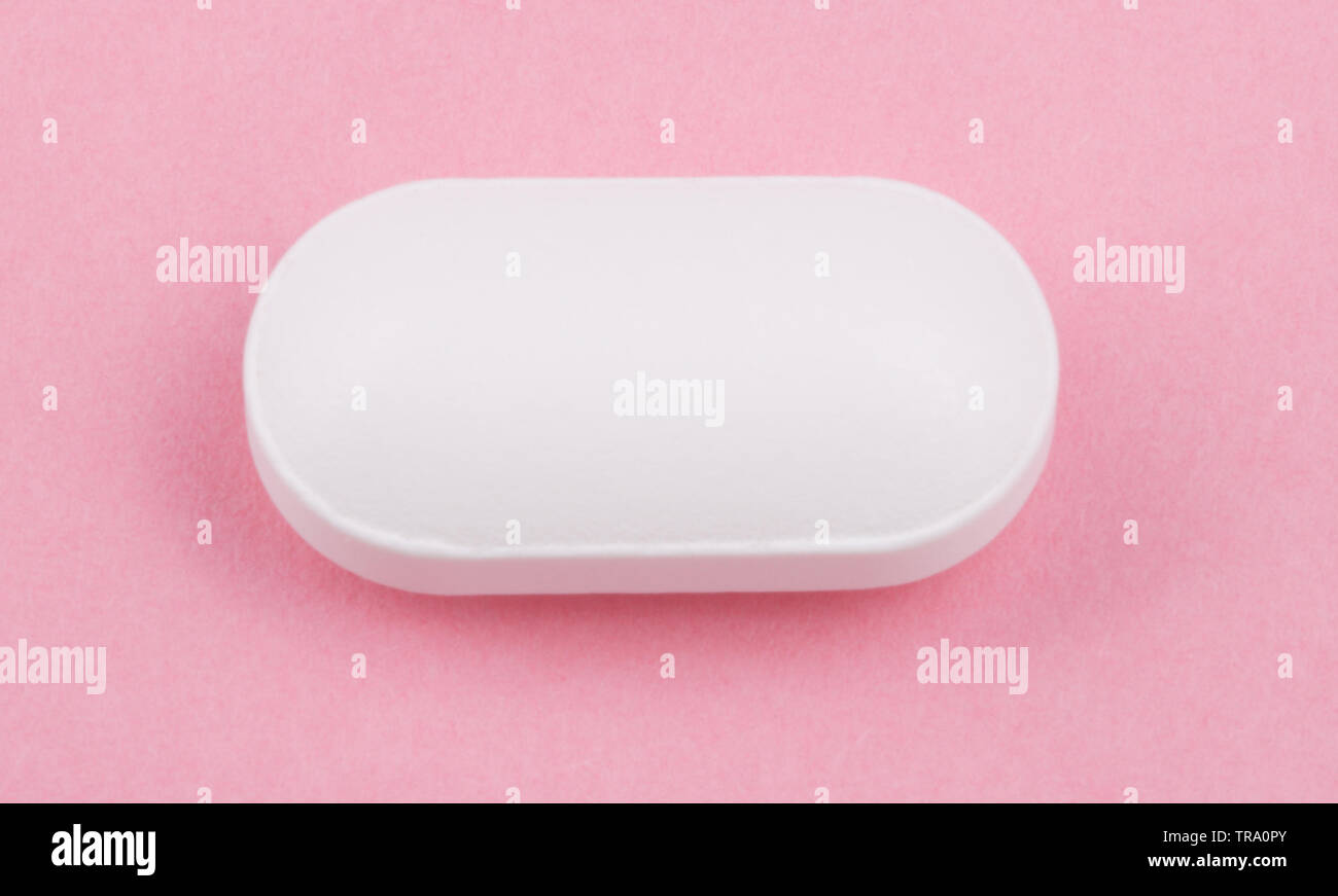 White Pill on Pink Background Stock Photo Alamy