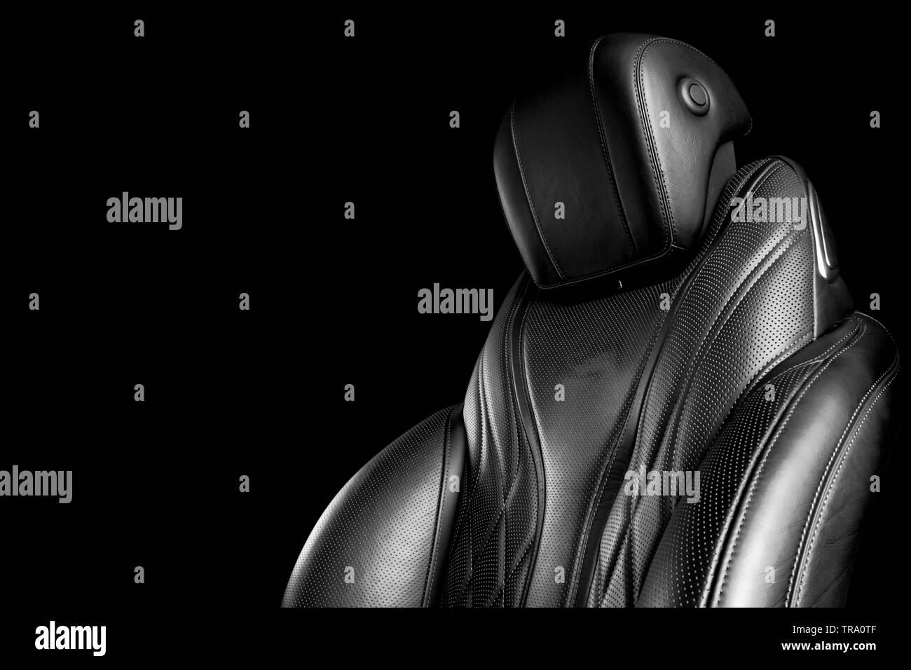 Black leather interior of the luxury modern car. Perforated leather