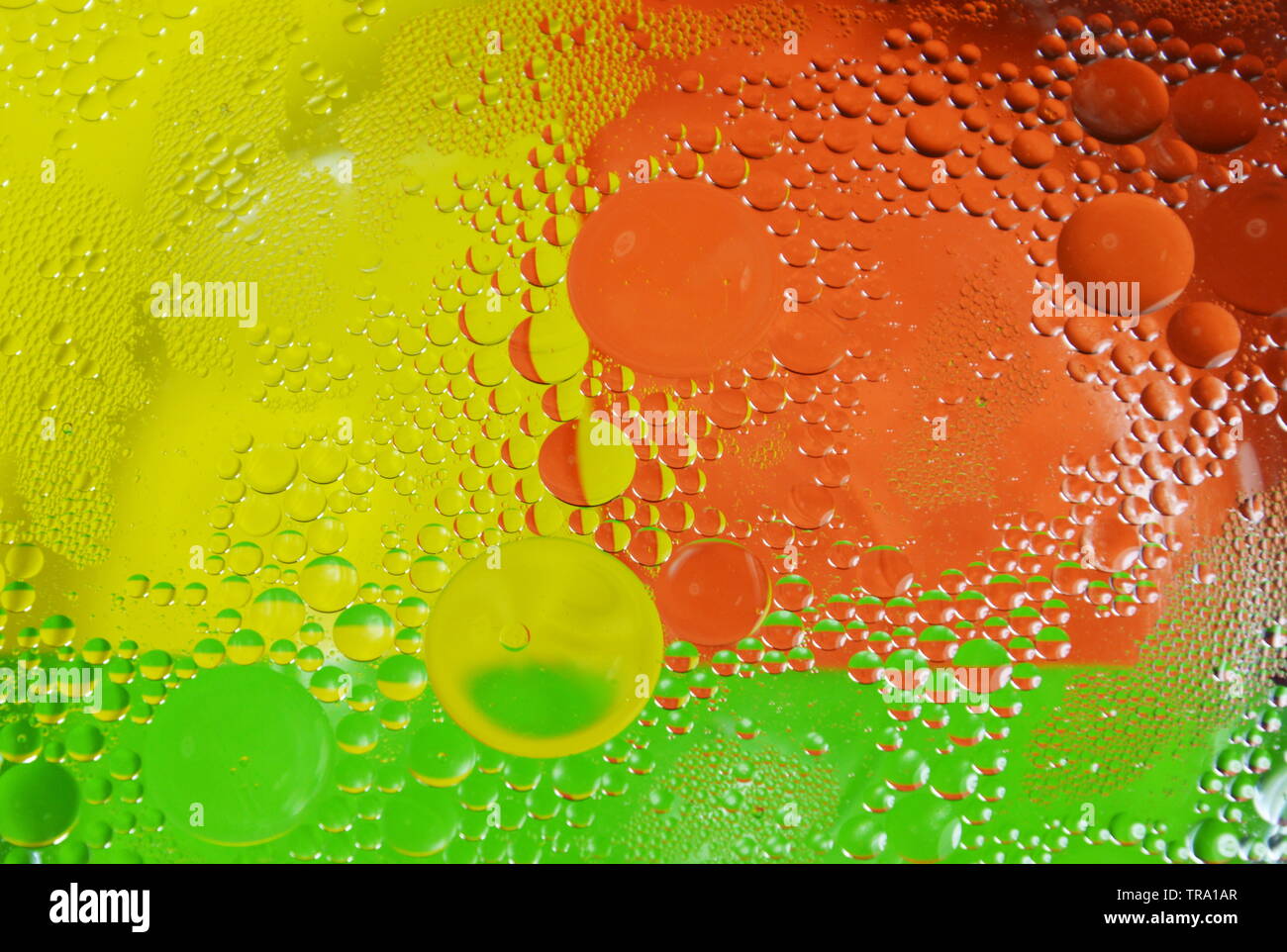 oil bubble floating on water surface in colorful background Stock Photo