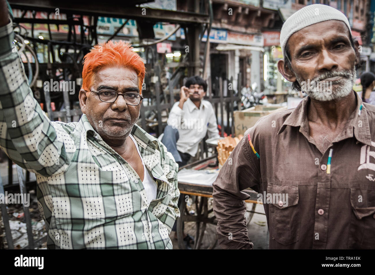A pair of men from India looking at the camera with a tough and hardened demeanor. These are street wise impoverished people Stock Photo