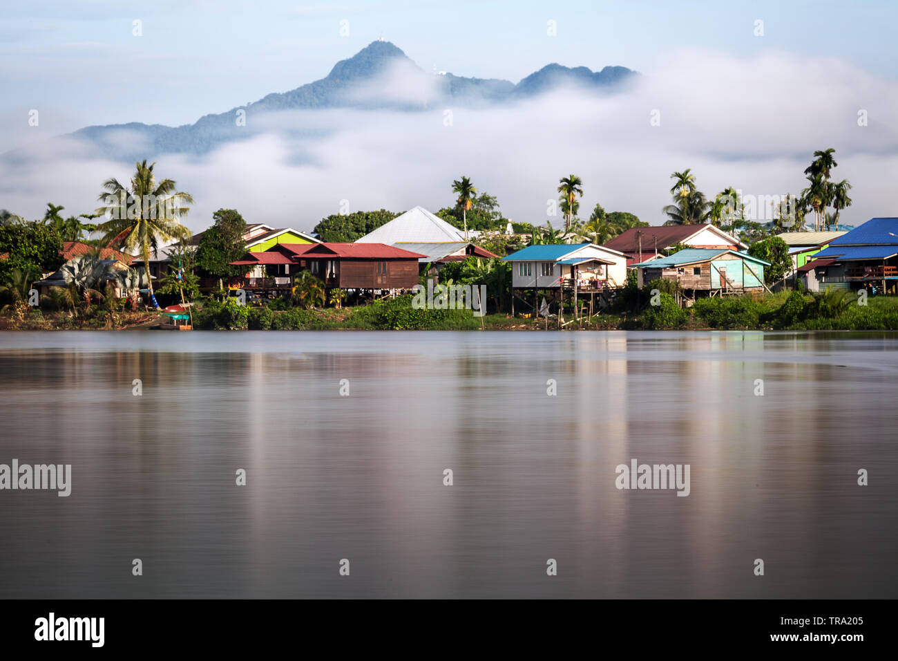 The Sarawak River with traditional rural scenics on the riverside. A  beautiful wide angle landscape image of real life conditions in Malaysian  Borneo Stock Photo - Alamy