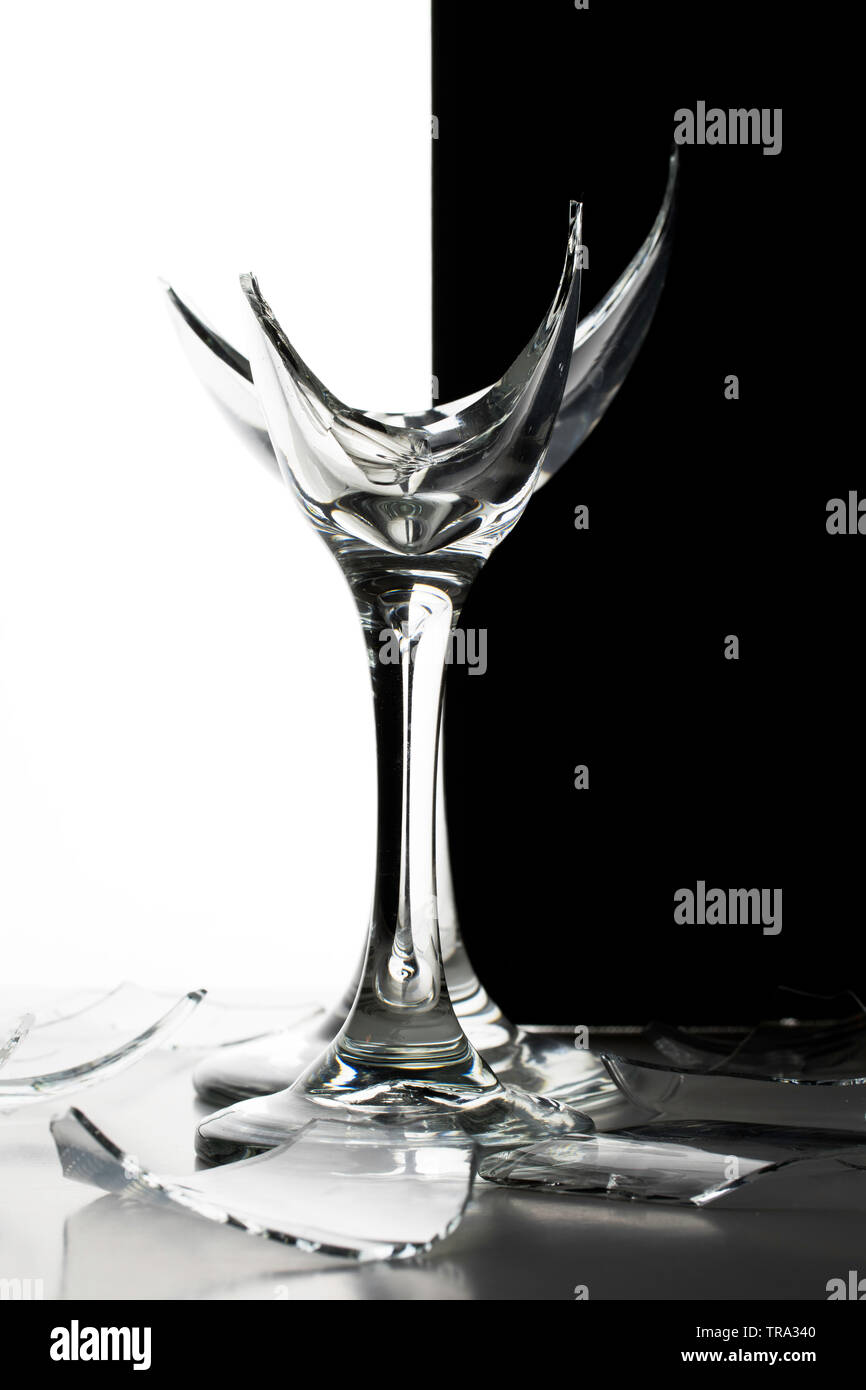 Two Broken Champagne Wine Glasses with with shards of glass and