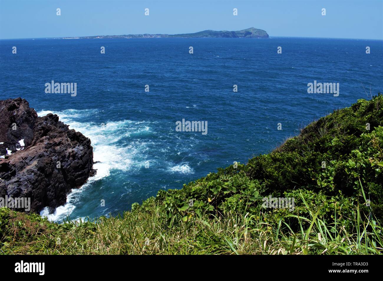 View at the island of Udo from Seongsan Ilchulbong tuff cone in Jeju, Korea Stock Photo