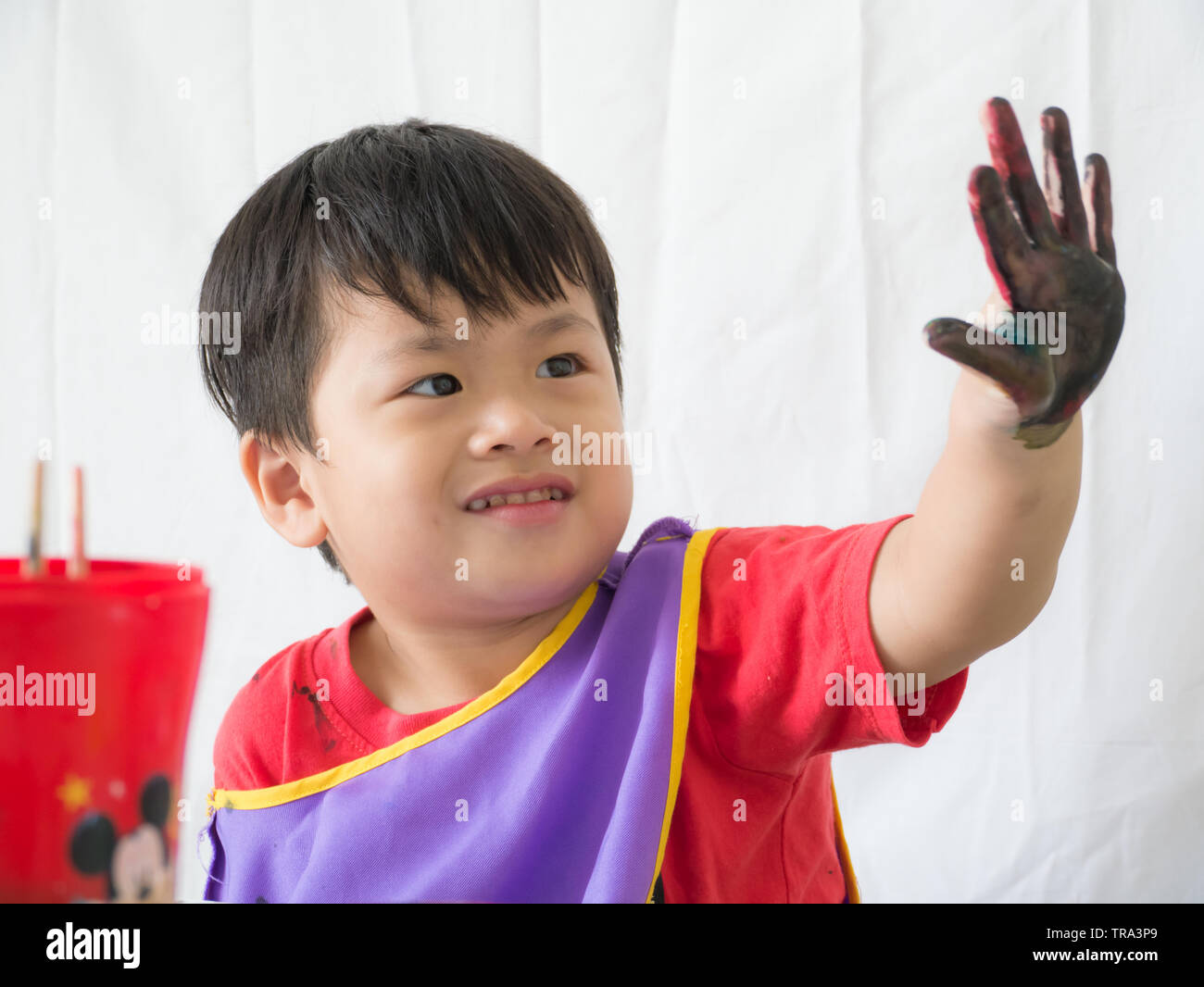 Asian cute boy holding dirty finger and smiling with happy, Stock Photo
