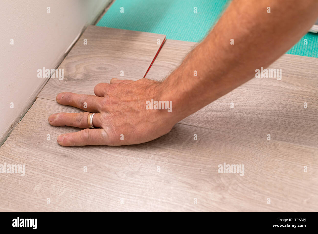 Craftsman Installing Laminate Flooring In New Apartment Stock