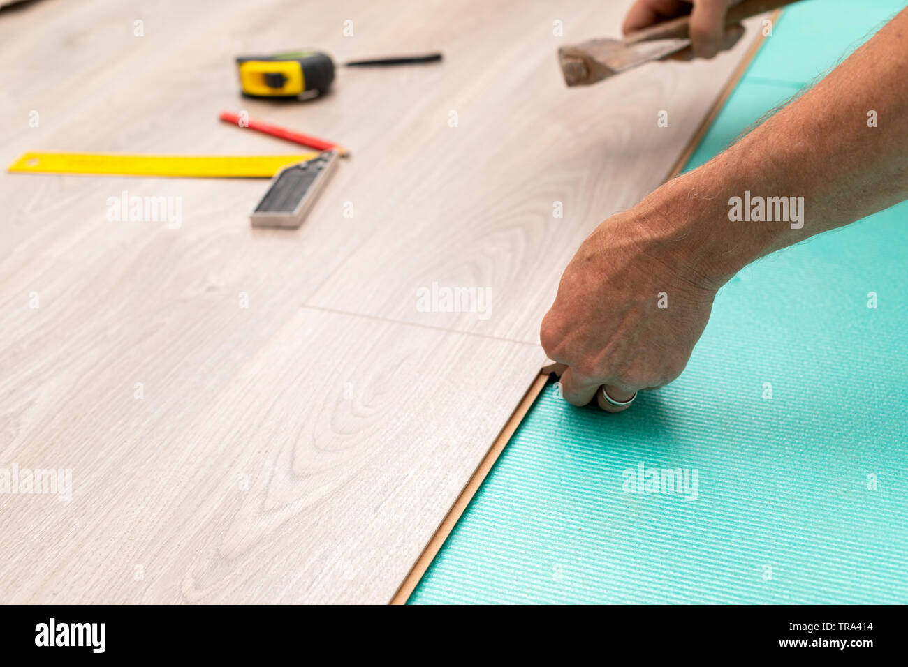 Craftsman Installing Laminate Flooring In New Apartment Stock