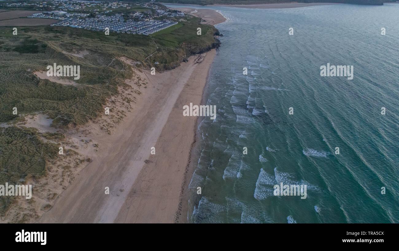 Waves heading to Shore, Aerial Capture of Beach in Cornwall with striped sand patterns Stock Photo