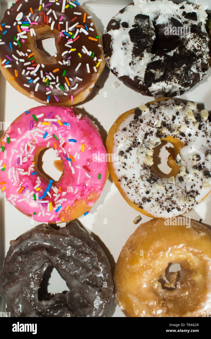 Delicious assorted doughnuts on a white background Stock Photo - Alamy