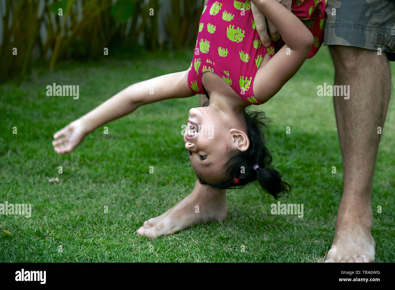 Father Holding Child Upside Down High Resolution Stock Photography and