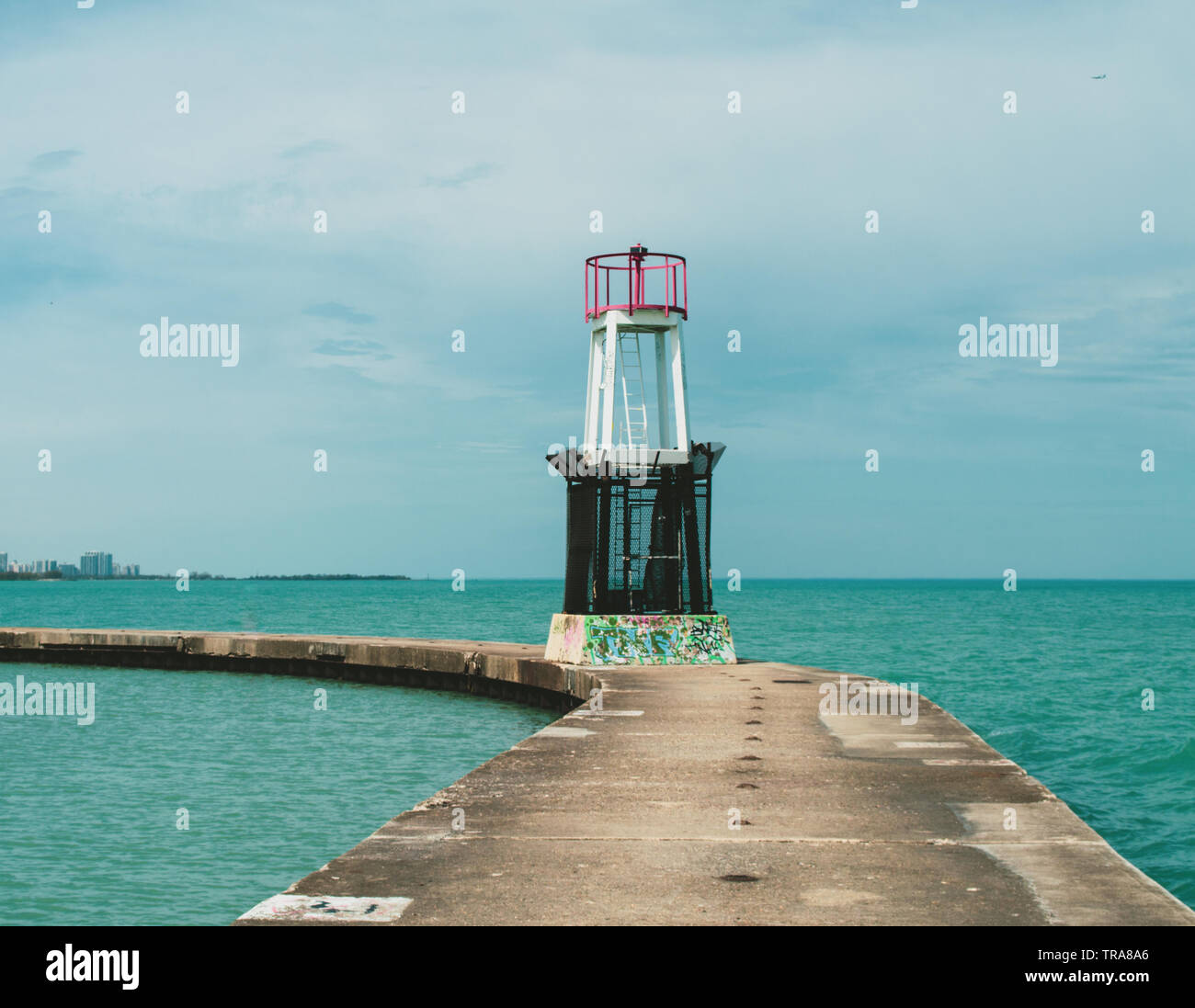 Passing a watch tower seen on a pathway surrounded by Lake Michigan in Chicago, Illinois Stock Photo