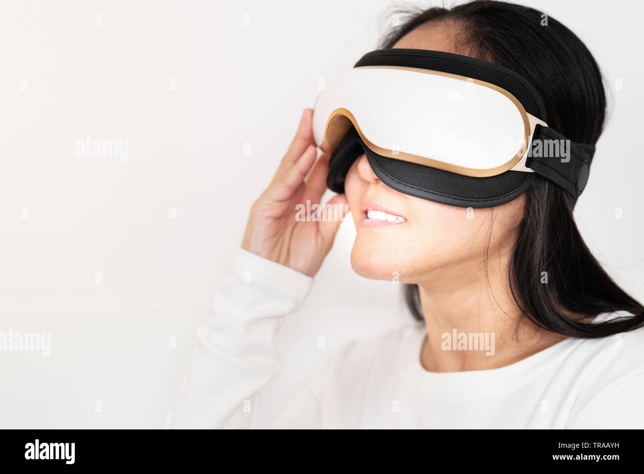 relax and massage, electric eye massage machine on women, closeup, healthcare and medicine concept Stock Photo