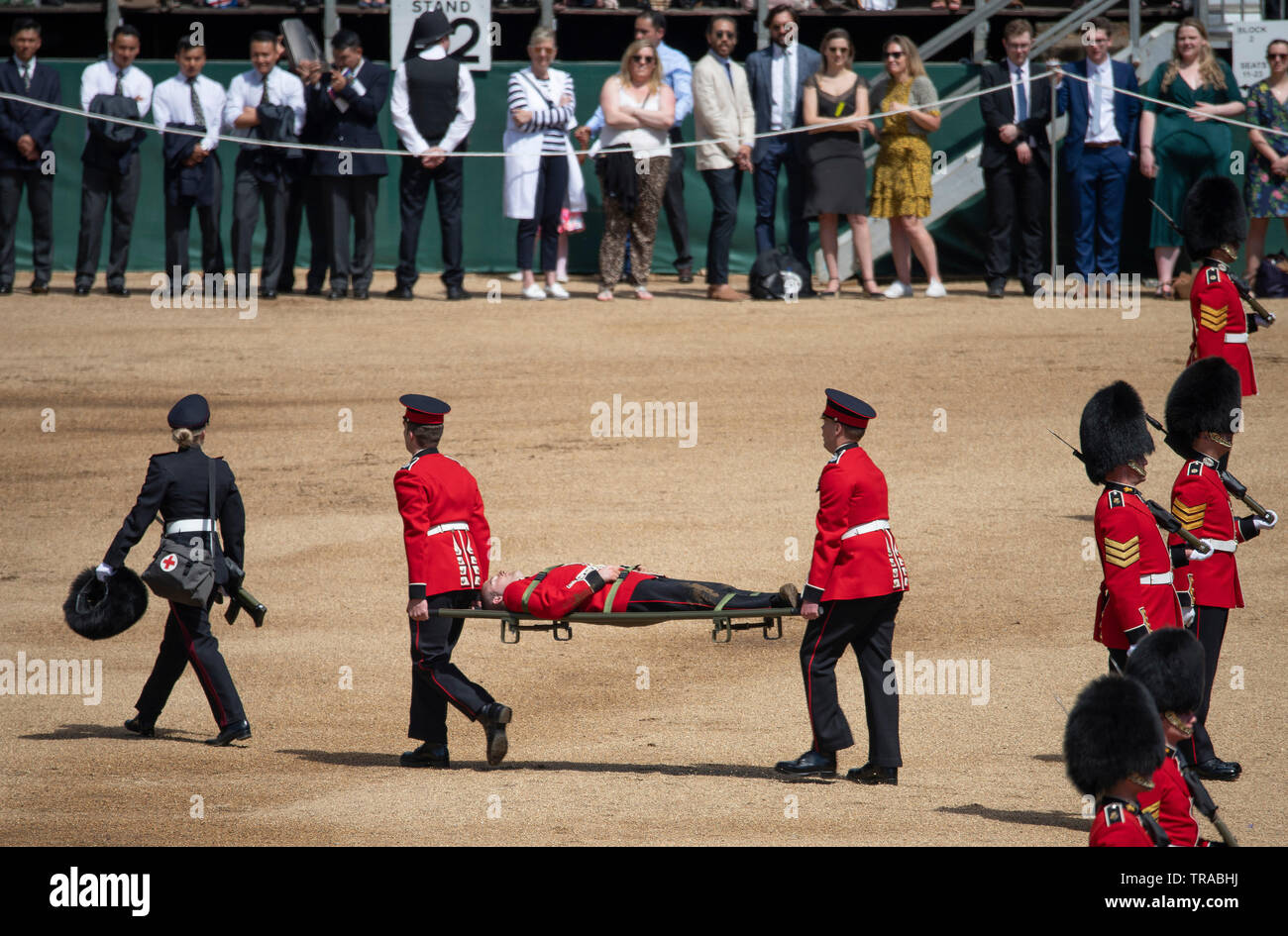 Horse Guards Parade, London, UK. 1st June 2019. Soldiers parade on Horse Guards for the final formal Review before Trooping the Colour on 8th June 2019 and are inspected by HRH The Duke of York. Image: In the rising temperatures of Horse Guards Parade several soldiers faint with heat exhaustion and are stretchered off. Credit: Malcolm Park/Alamy Live News. Stock Photo