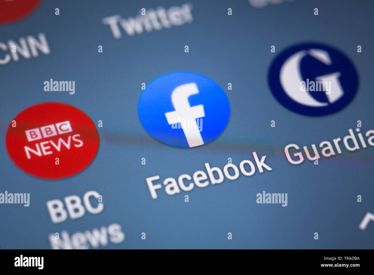 Facebook logo icon on mobile phone screen Stock Photo