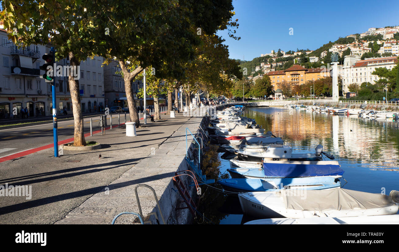 Boats and Urban Life at Waterfront of the River Rjecina in Harbor City Rijeka, Croatia Stock Photo