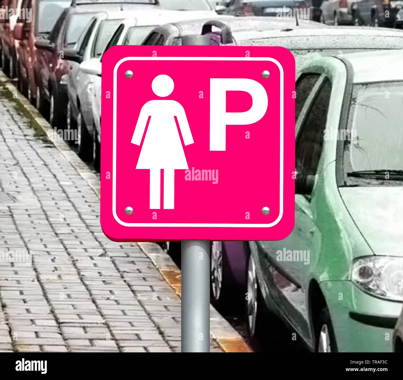 The pink sign for parking cars for women only at full parking lot ...
