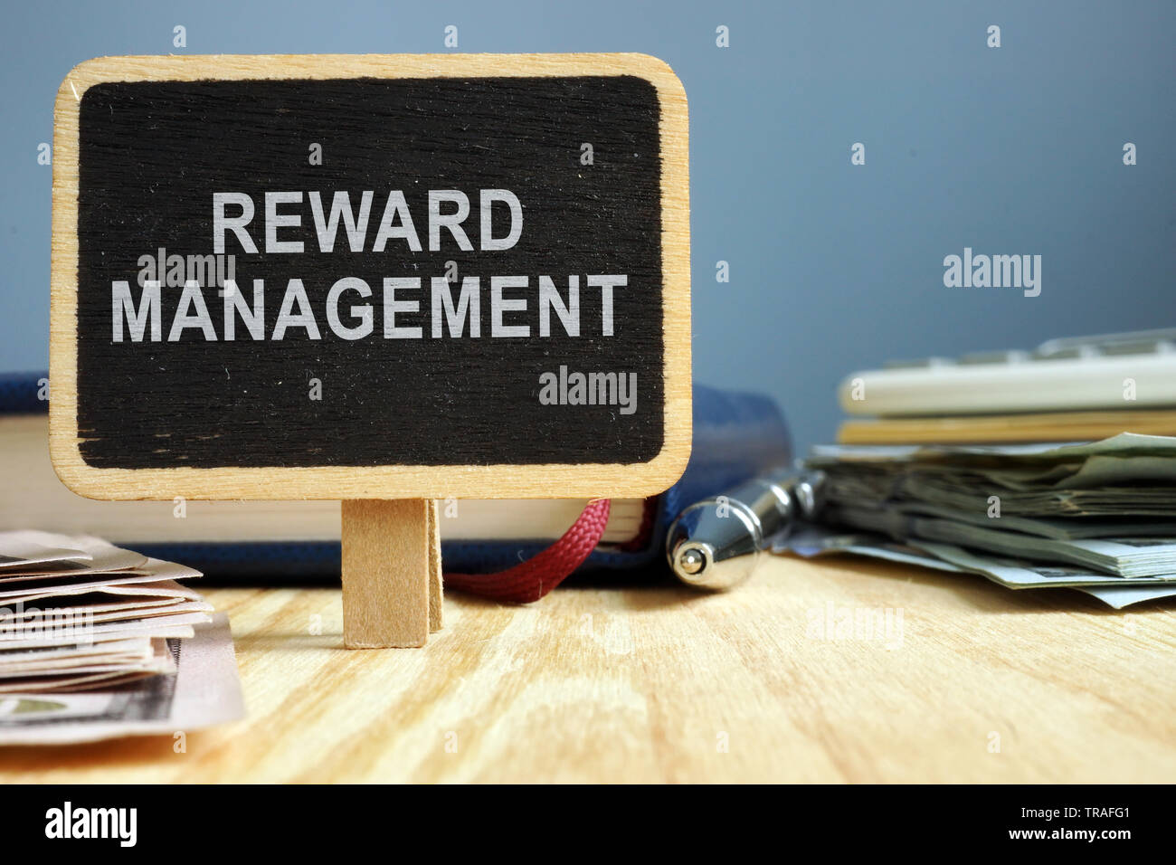 Reward management concept. Office table with note pad. Stock Photo