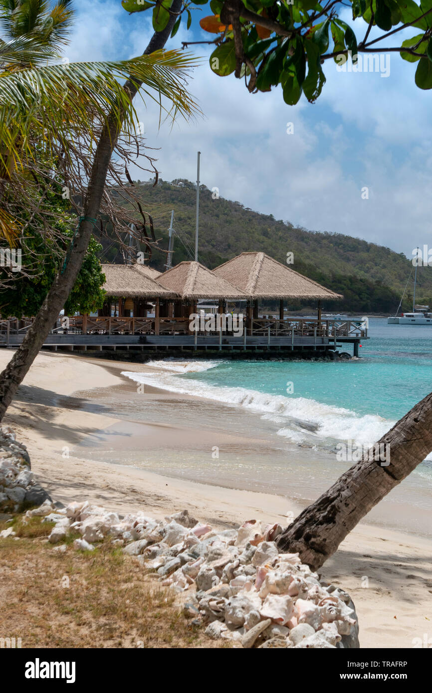 Lovell village on the beachfront on mustique hires stock photography