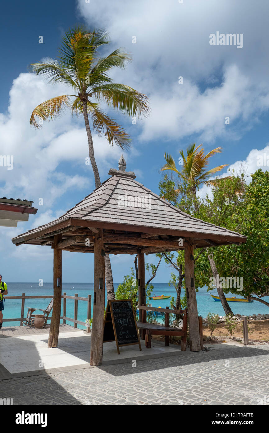 Lovell village on the beachfront on mustique hires stock photography