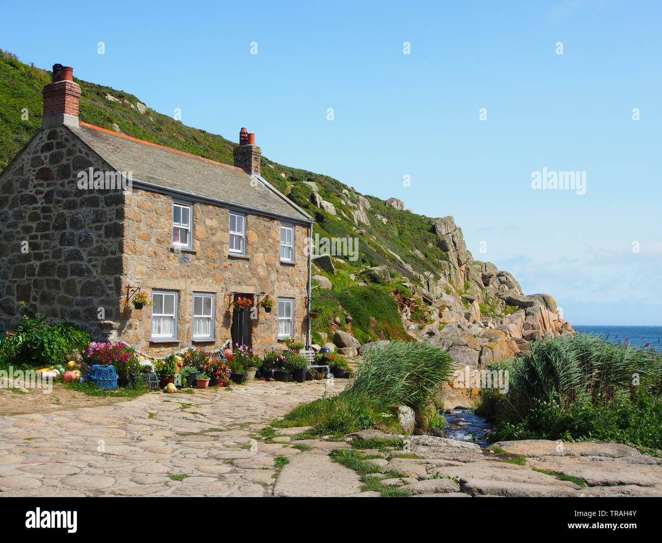 Typical Cornish cottage, built directly on the shoreline at Penberth