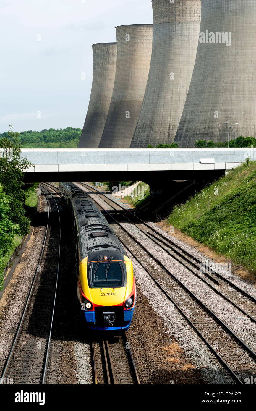 East Midlands class 222 Meridian diesel train passing Ratcliffe Power Station, Nottinghamshire, England, UK Stock Photo