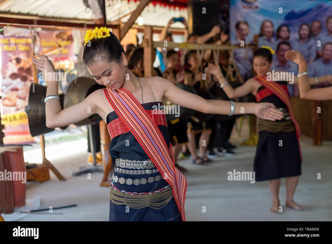 Beautiful young girls from Kota Belud Kadazan Dusun ethnic performed traditional dance during state level Harvest Festival in KDCA, Kota Kinabalu, Sab Stock Photo