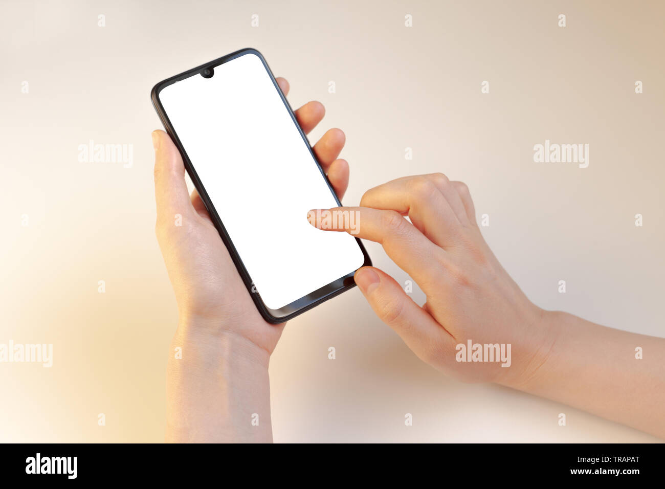 Female left hand holding phone and index finger of another hand at the