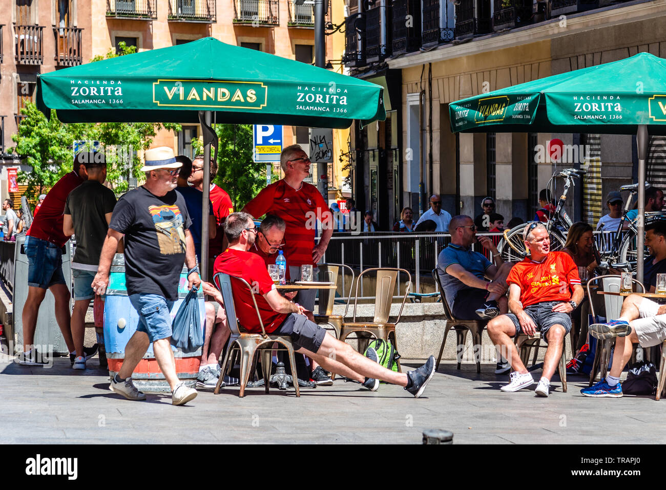 Madrid, Spain - June 1, 2019: Liverpool fans enjoy in terrace in Plaza Mayor prior to the UEFA Champions League Final match between Tottenham Hotspur Stock Photo