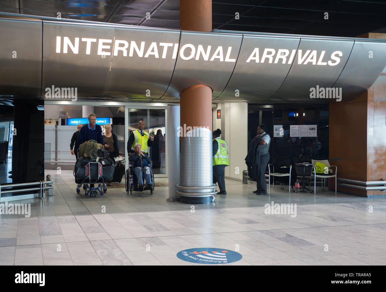 tourists and people arriving and coming through the doors of the  international arrivals hall at Cape Town International Airport, South  Africa Stock Photo - Alamy