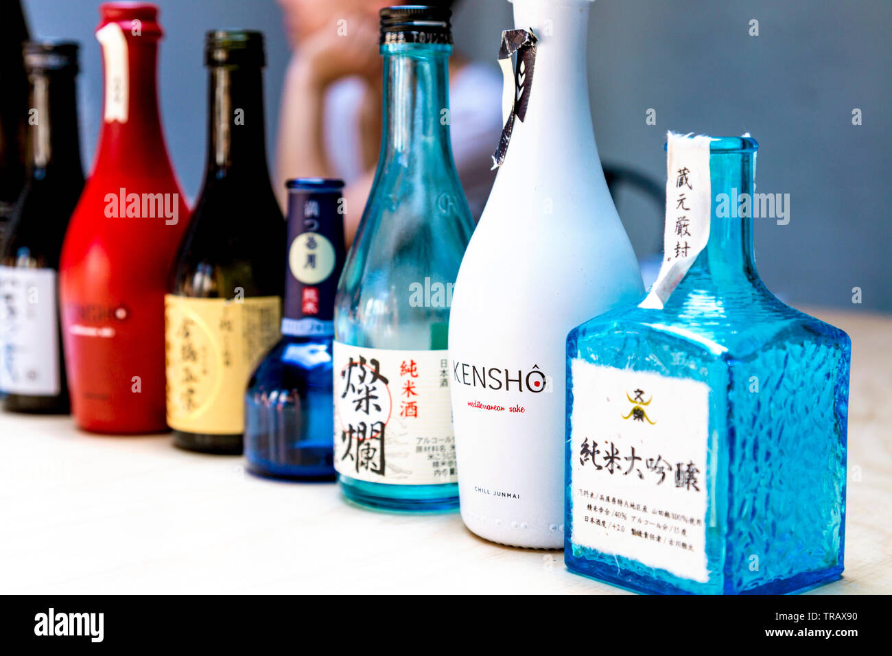 A selection of empty sake bottles Stock Photo