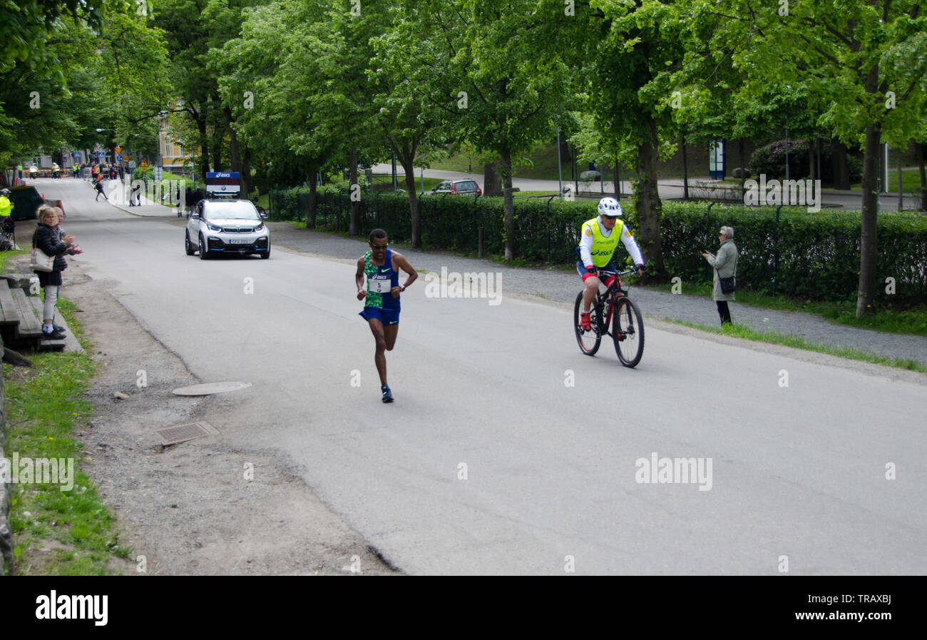 Stockholm, Sweden - 1 June 2019. Nigussie Sahlesilassie, the winner of Stockholm Marathon on the final straight behore running into Stockholm Stadium Stock Photo