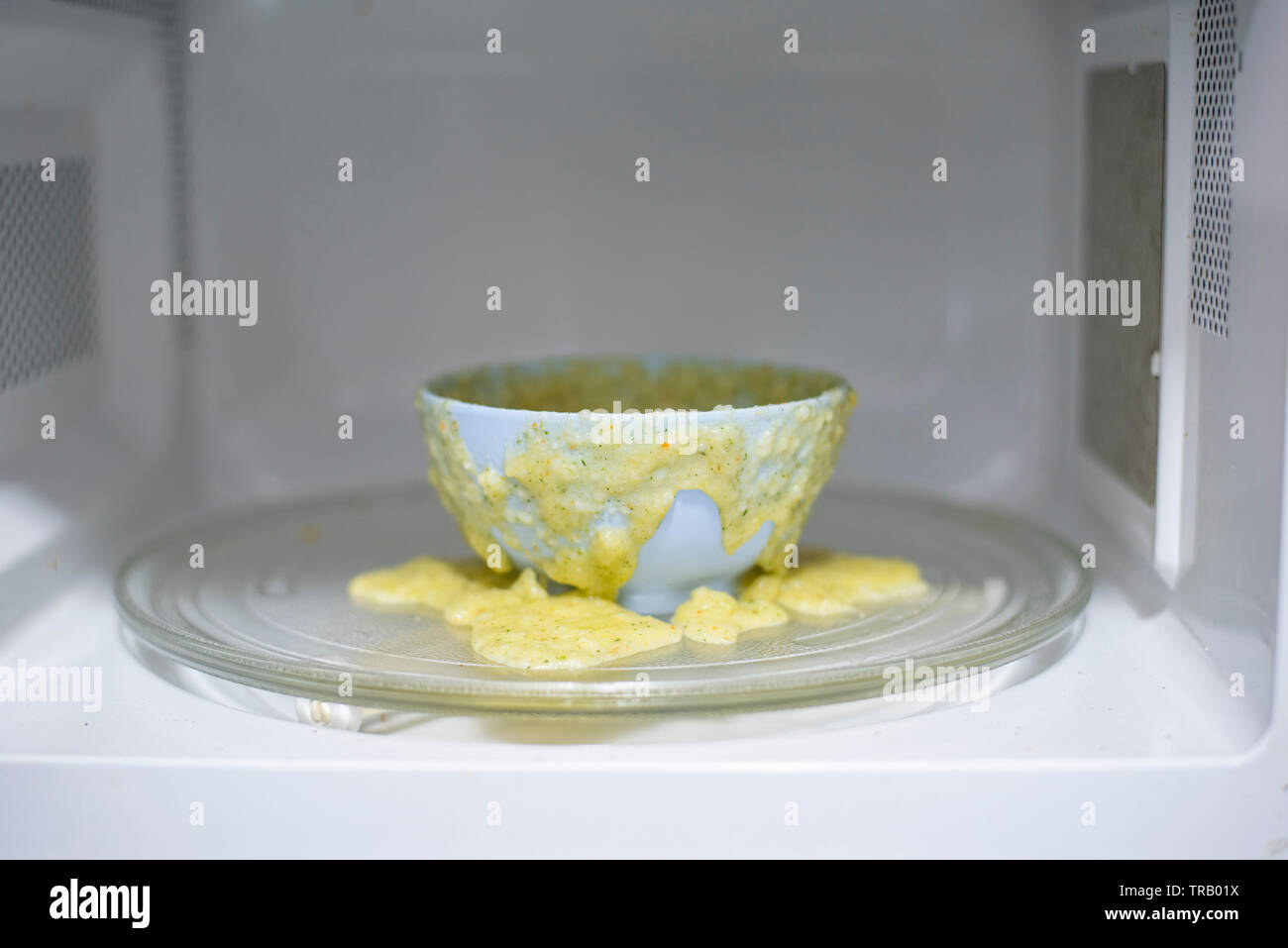Food exploded in microwave oven / warning oven with cup food overflow