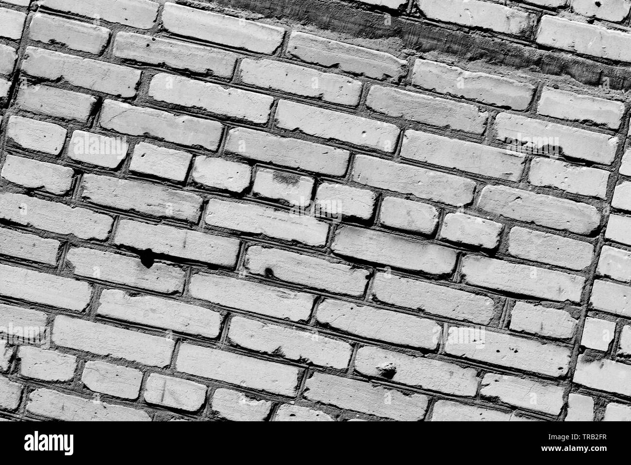 Old brick wall texture close up. Brick wall background black and white