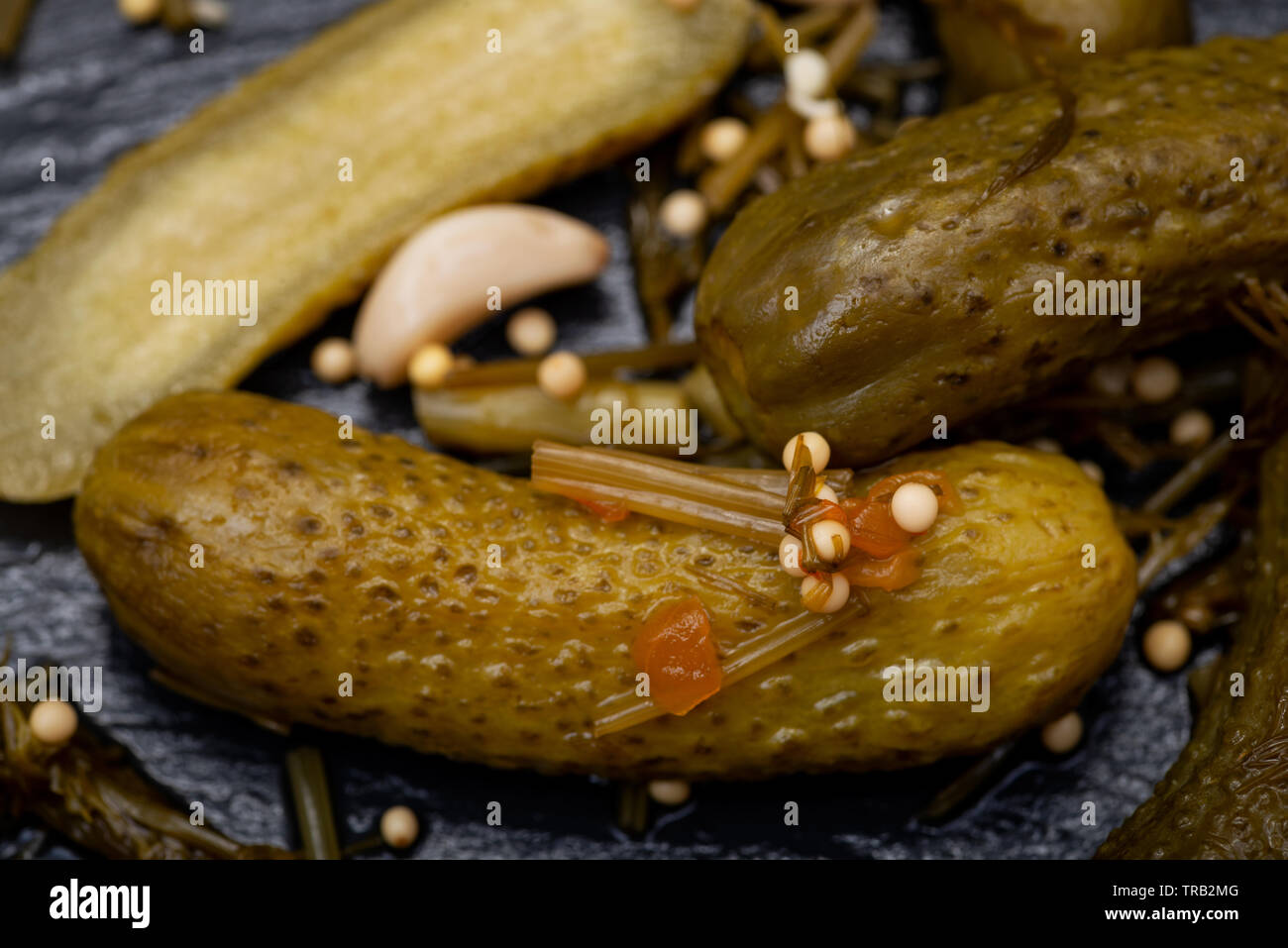 Extra Fine Cornichons minuscule sour French pickles on natural stone