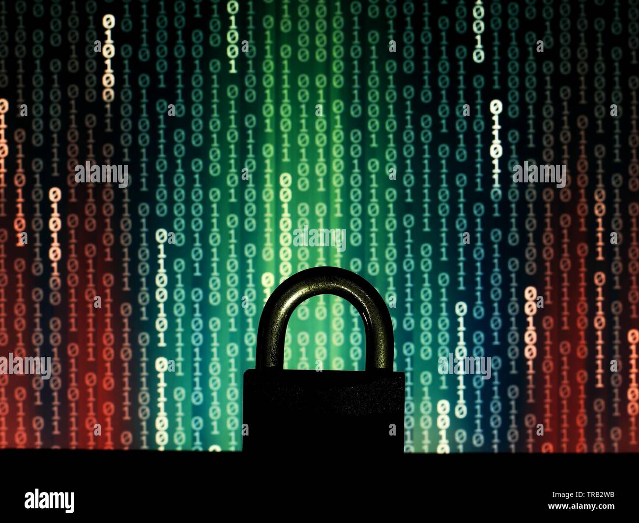 closed padlock in front of matrix style computer language binary data code. blue green binary surrendered by red code. protecting the user privacy aga Stock Photo