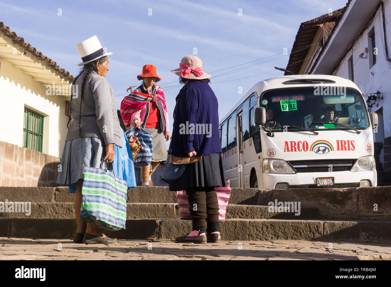 Peruvian women in traditional dresses on the street of Cusco, Peru
