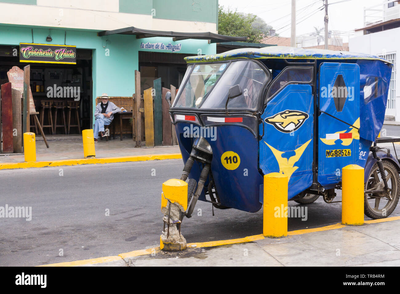 Barranco, Lima, street scene - Blue mototaxi parked in the street. Stock Photo
