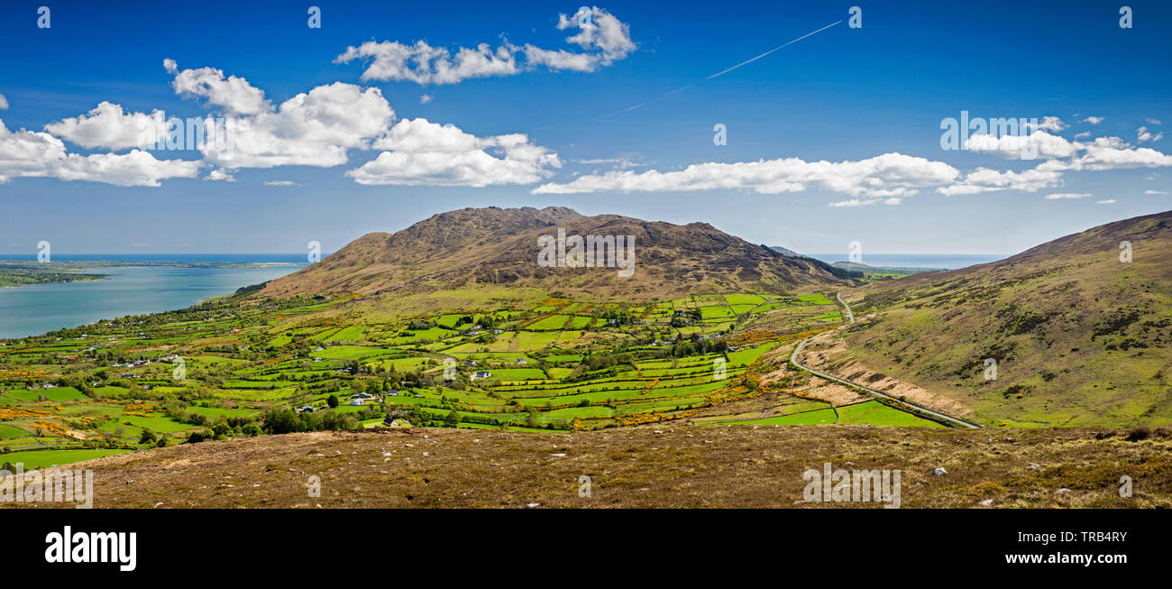 Ireland, Co Louth, Cooley Peninsula, Black Mountain, rocky landscape towards Carlingford Mountain, with road crossing Windy Gap, panoramic Stock Photo